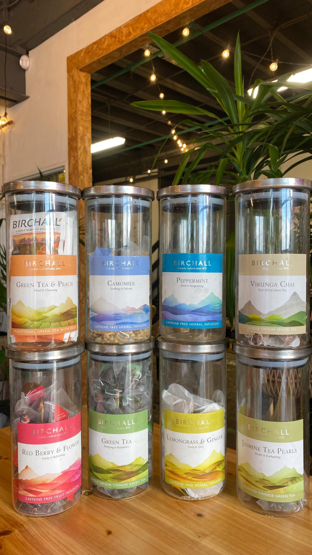 Jars of Birchall herbal teas on the wooden counter